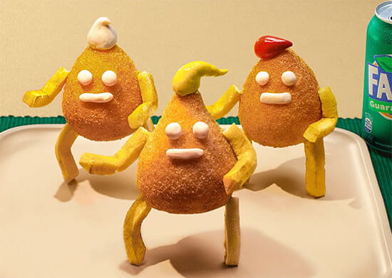 coxinha elaborada com rosto, braços e pernas